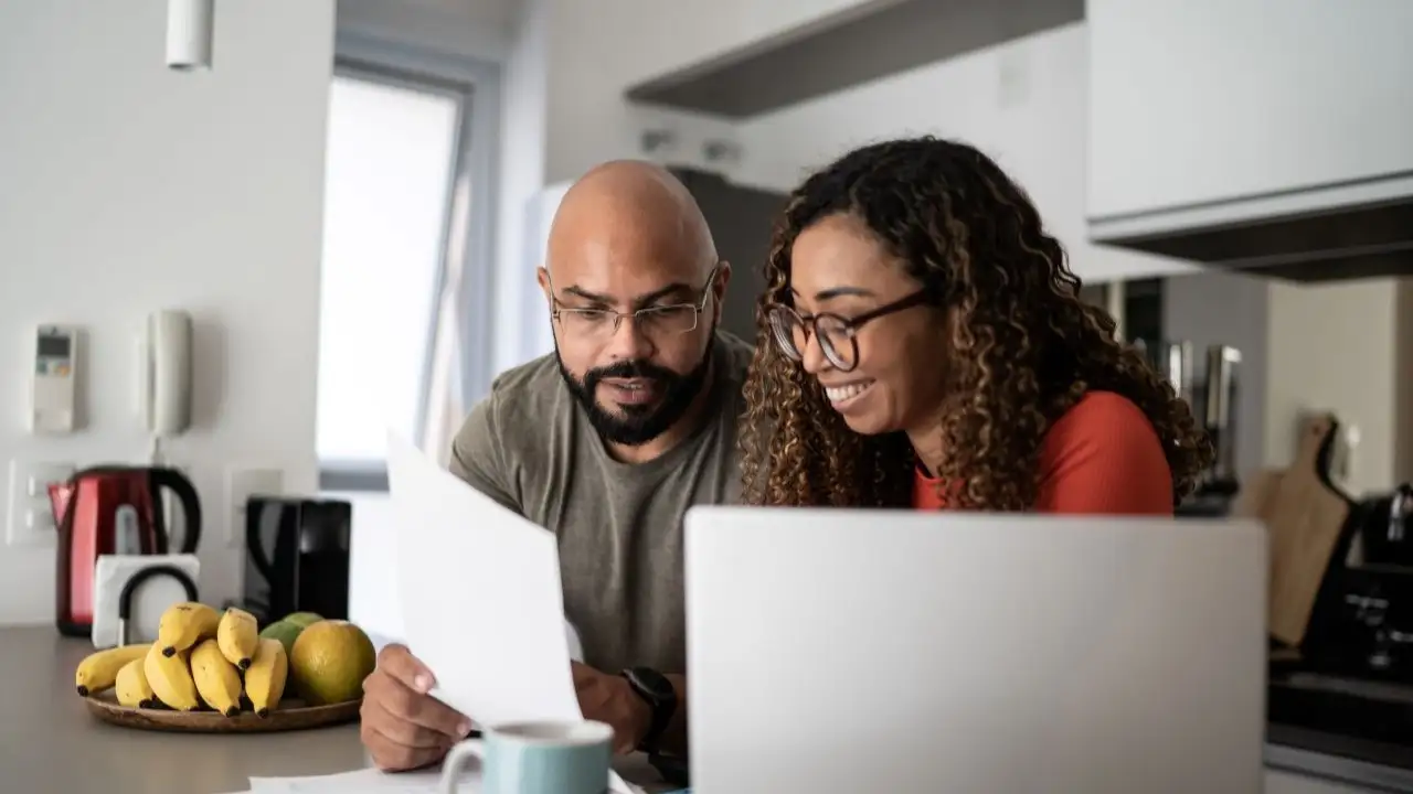 Couple doing home finances together at home