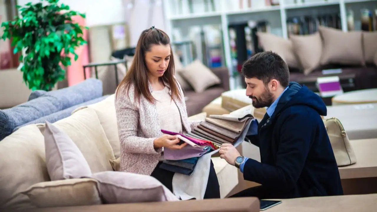 Couple at a furniture store choosing fabrics