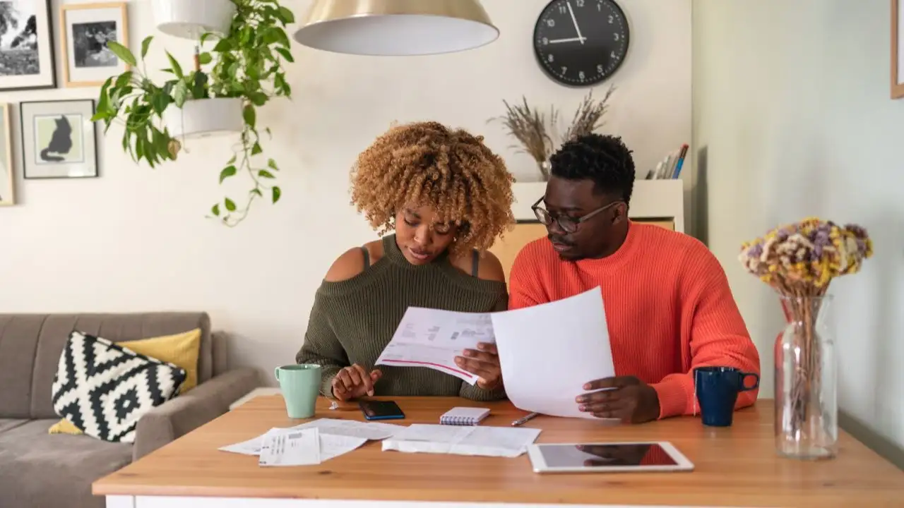 Young couple revising their budget.