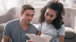 Couple checking credit report and how to use credit card