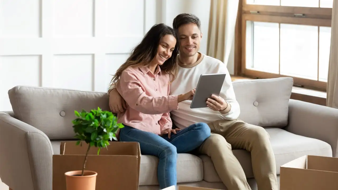 Couple using digital tablet searching for a HELOC to make home improvements