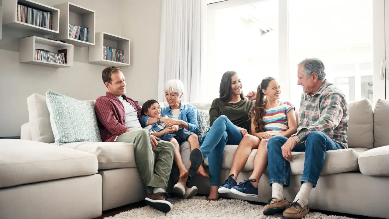 Multigenerational family talking about money, life, and fun