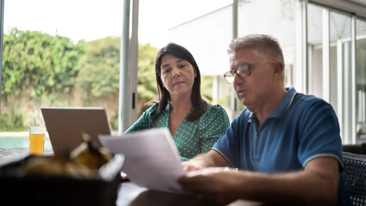 Mature couple reviewing home finances