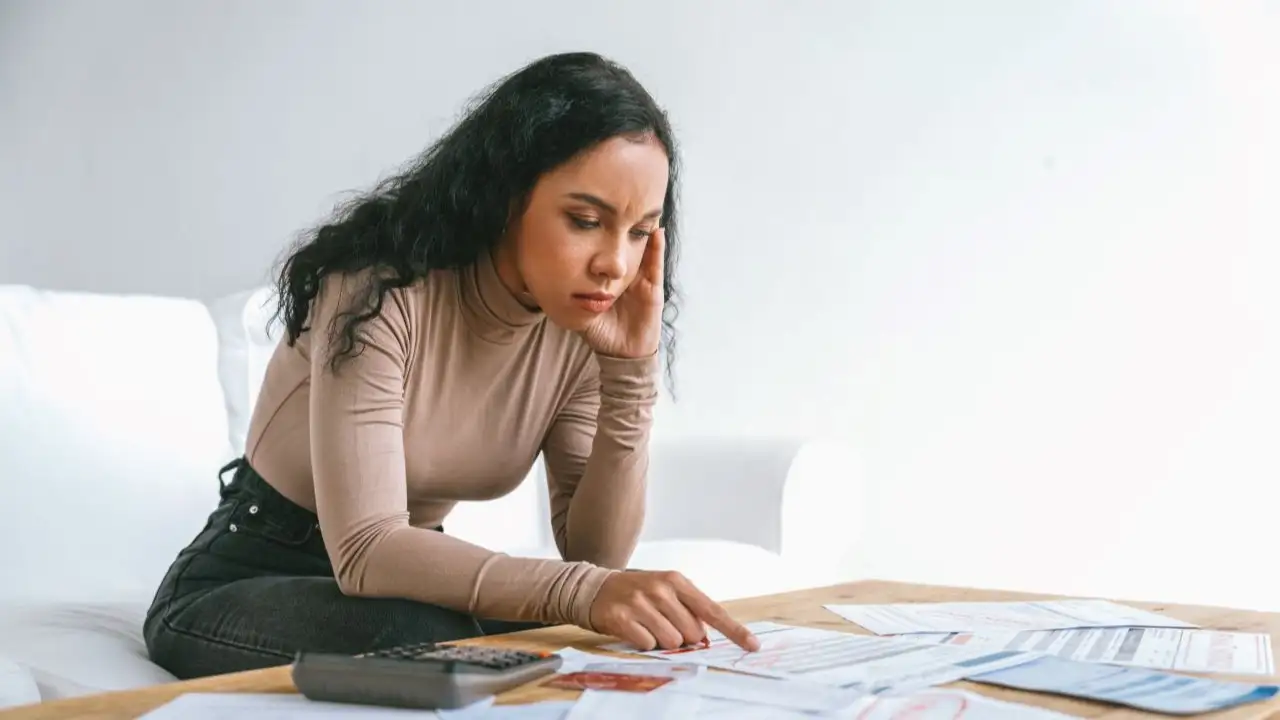 Woman dealing with credit card bills and collection letters