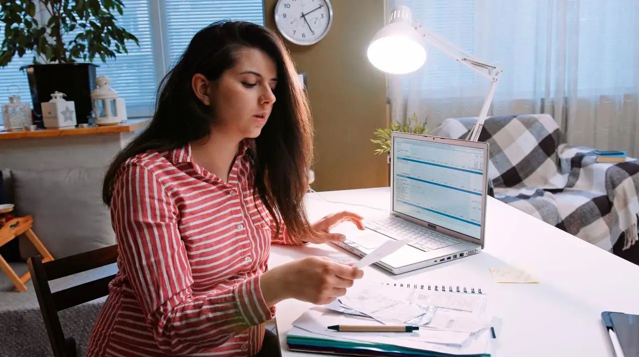 Pregnant women checking her finances and credit