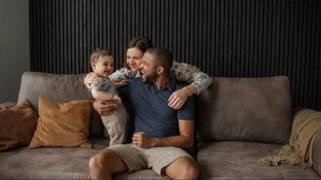 Parents with young child in living room