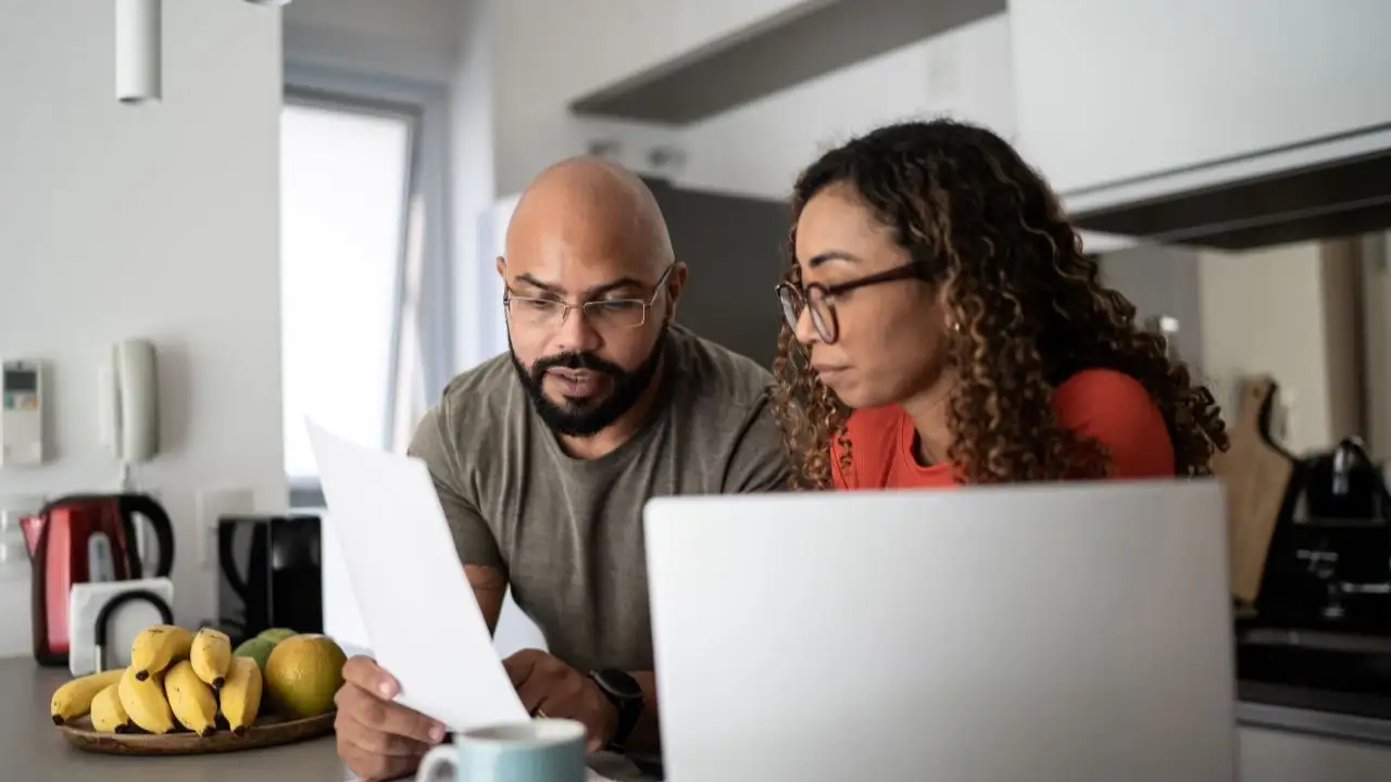 Couple doing home finances together at home