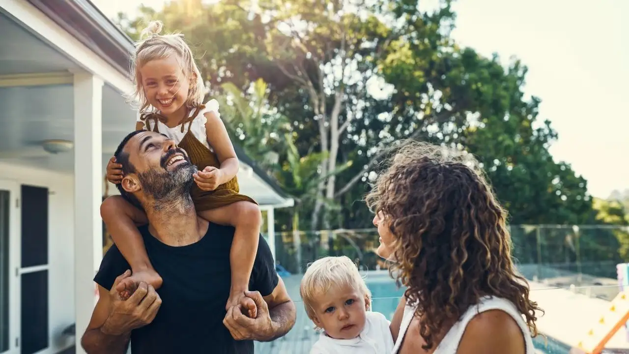 Happy young family spending the weekend together at home