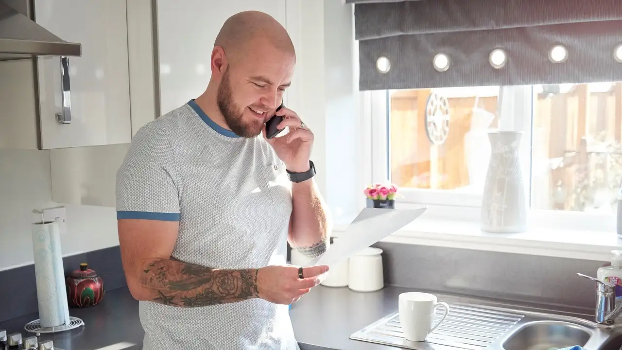 A young adult sorting his home finances out.