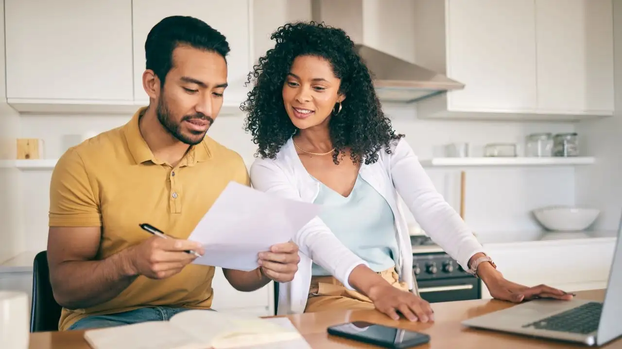 Couple reviewing budget and saving goals